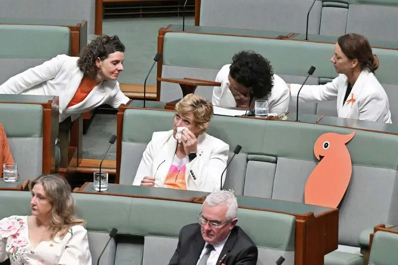 Australian Parliament pays tribute to injured lawmaker as it resumes work under increased security