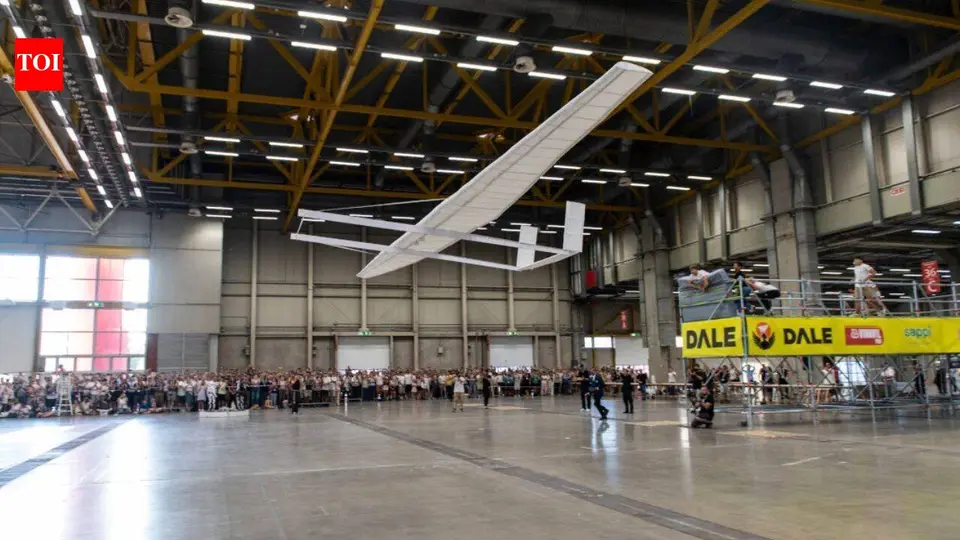 Seven Italian students built a paper aircraft with a 20 - metre wingspan and successfully flew it inside a hangar