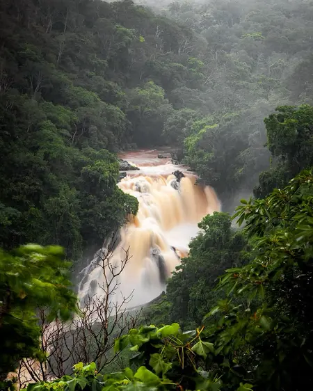 Moyar River floods after heavy rain , leaving Nilgiris village cut off